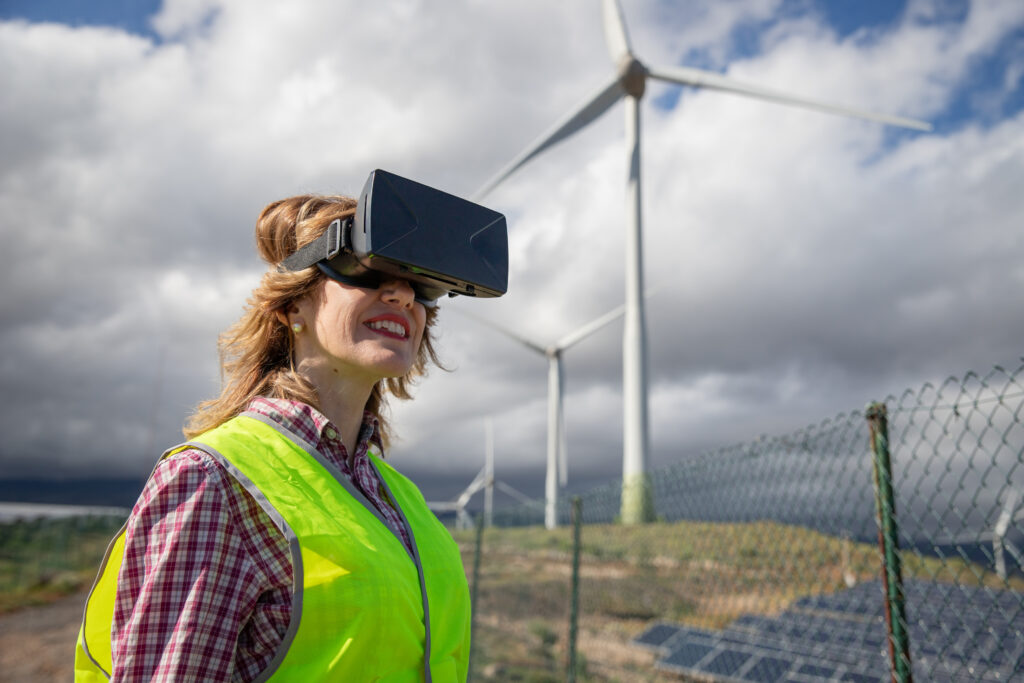 An engineer wears augmented reality goggles at a solar farm, sustainable energy concept